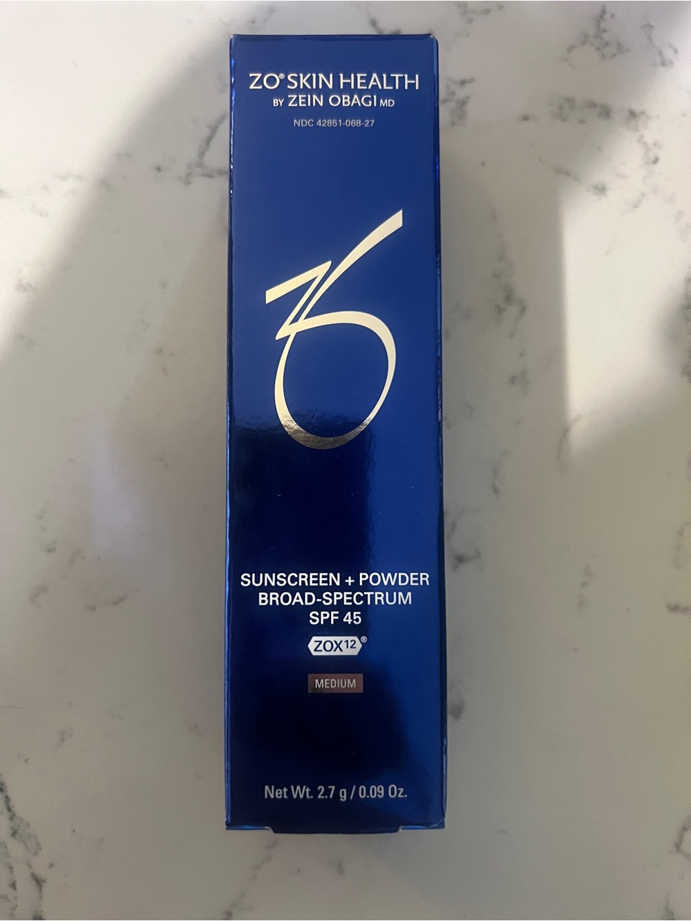 Obagi ZO Skin Health Sunscreen + Powder in Deep Blue Packaging
